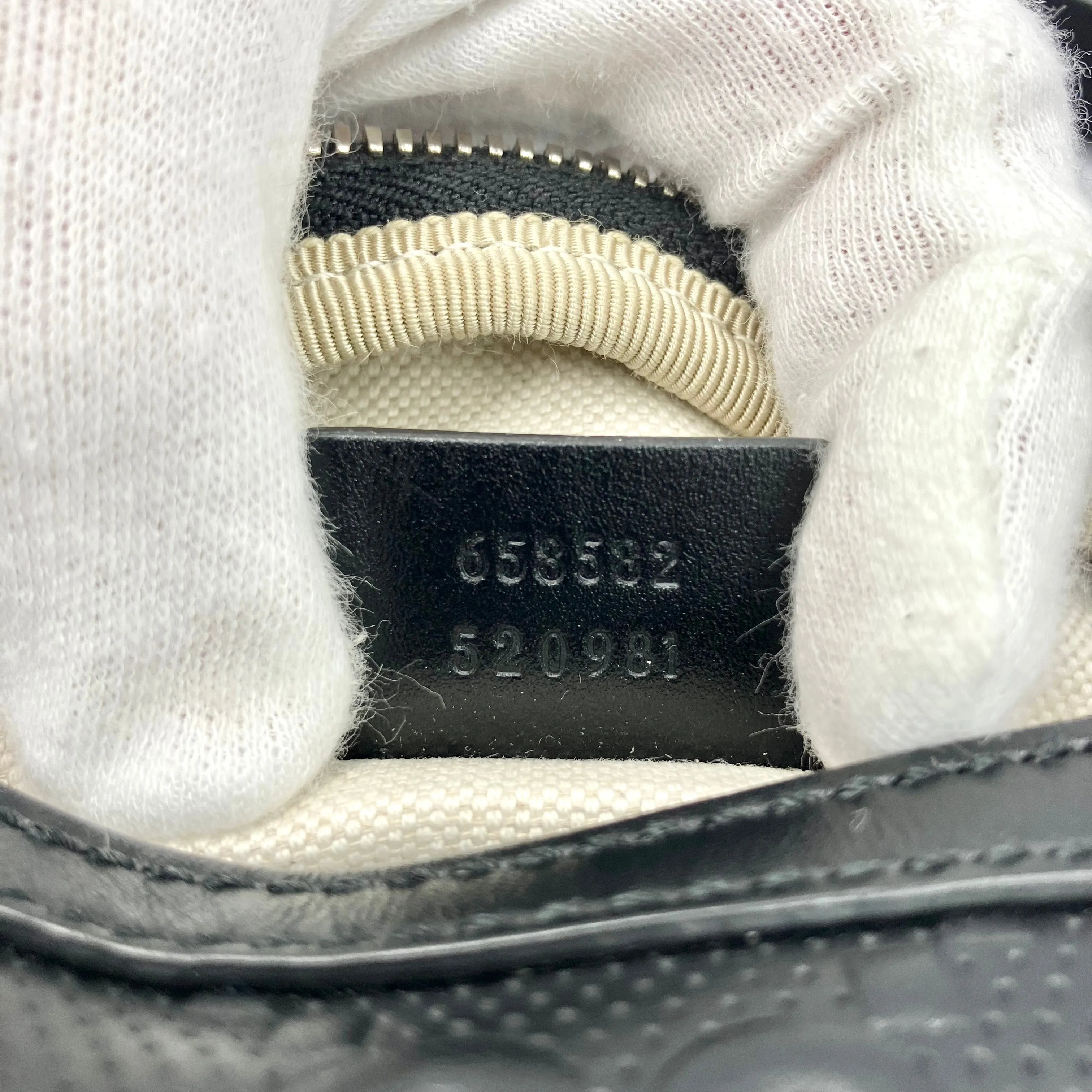 GUCCI GG Embossed body bag